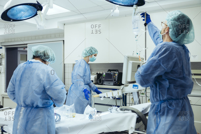 An IV bag hanging in a hospital room stock photo - OFFSET