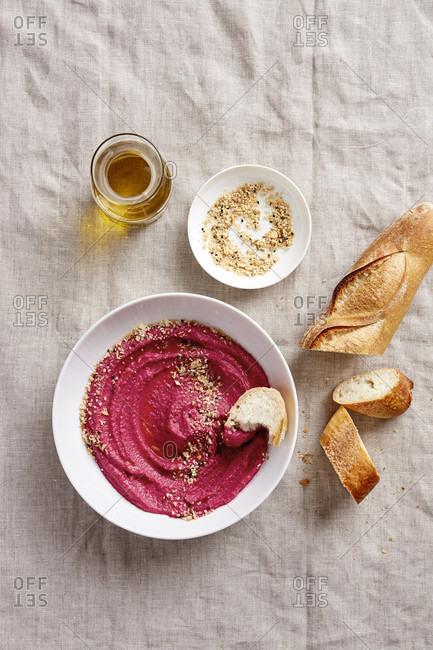 Beetroot Hummus with Dukkah and Baguette Dipped