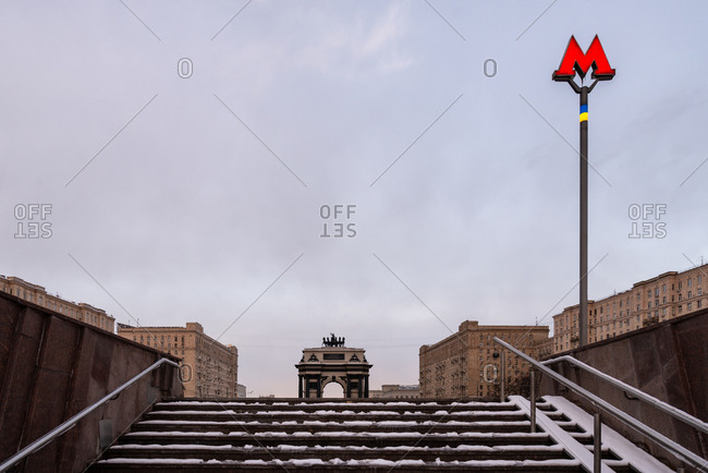 Moscow, Russia - March 31, 2020: Empty stairs to the subway covered in snow during the first mandatory quarantine week