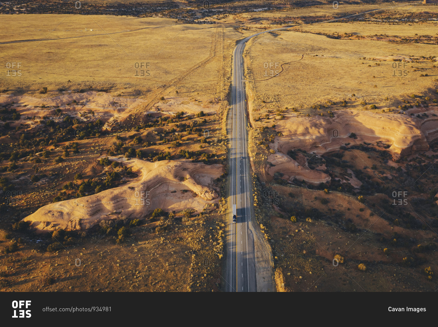Lonely Utah\'s road in the evening with a truck from above