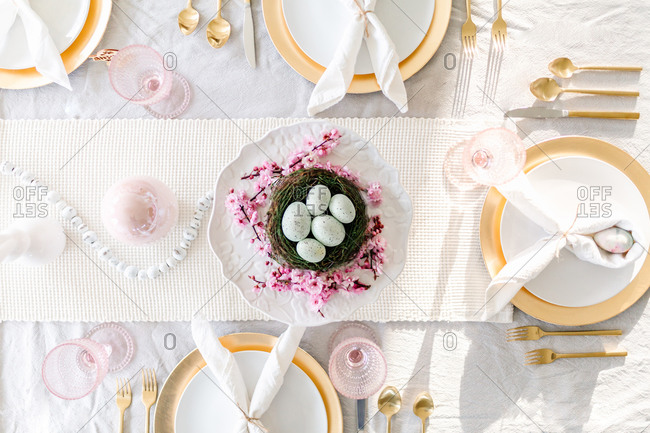 overhead shot of easter tablescape with cherry blossoms