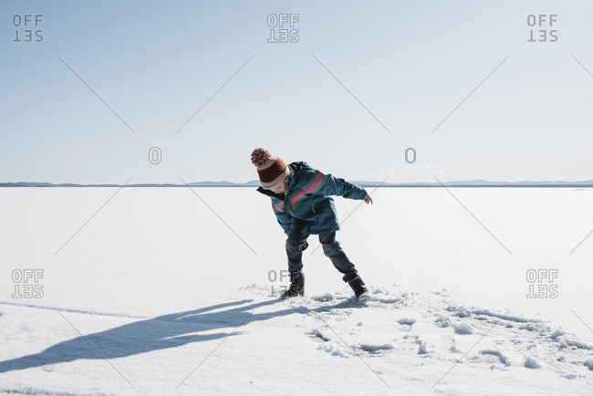 Girl walking on an icy lake in Sweden