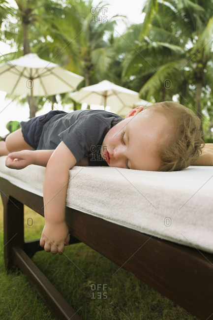 Little boy sleeping on son lounger- Koh Samui- Thailand