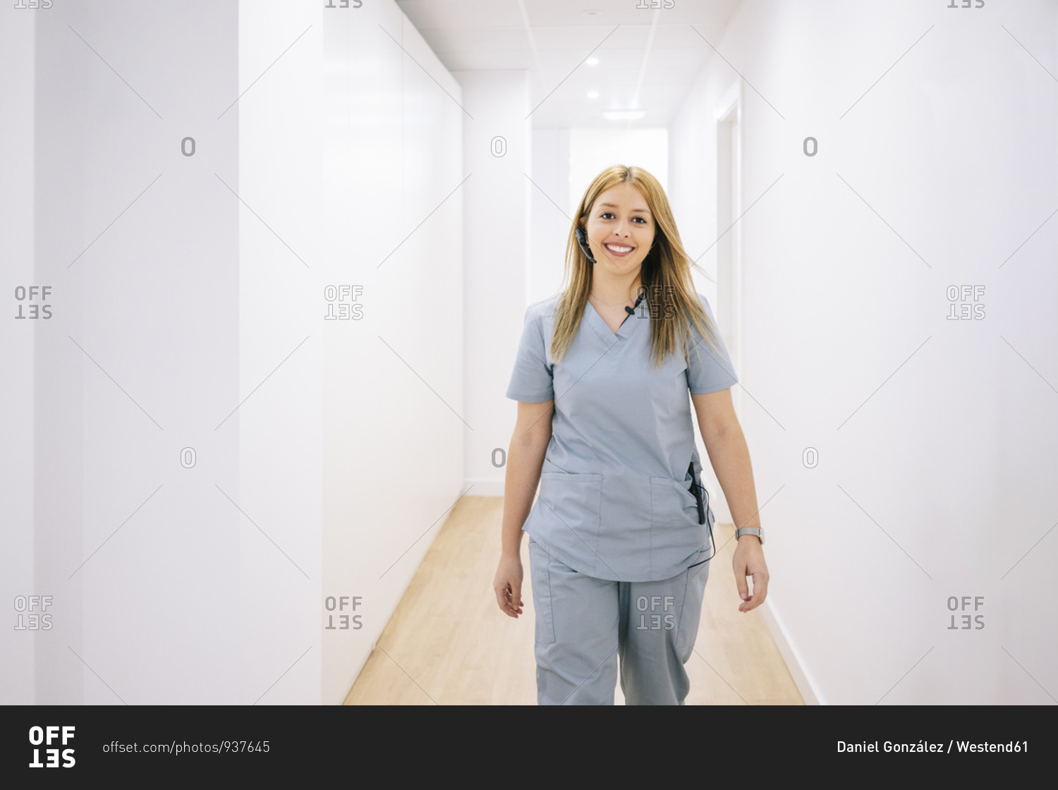 Portrait of smiling medical secretary with headset in medical practice