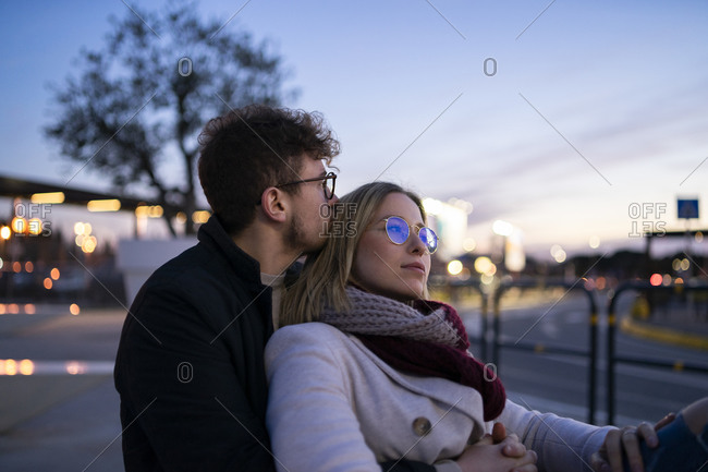 Young couple in love at evening twilight