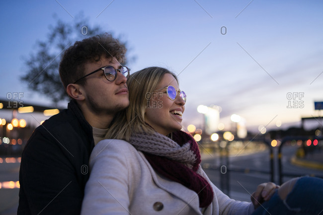 Young couple in love at evening twilight