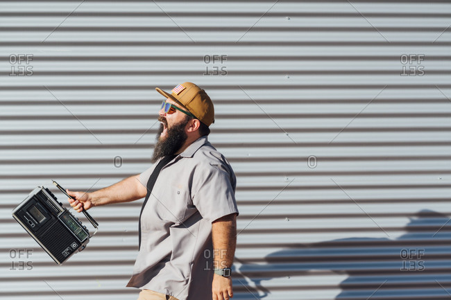 Bearded man with portable radio
