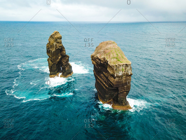 Aerial view of Ilheu dos Mosteiros rock formations carved by nature off the coast of Sao Miguel island, Azores, Portugal.