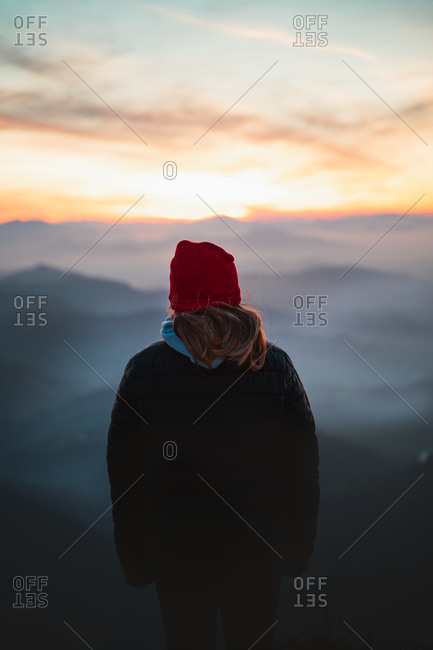 Mountaineer watches the foggy sunset in mountain Pe�as de Aya, Basque Country