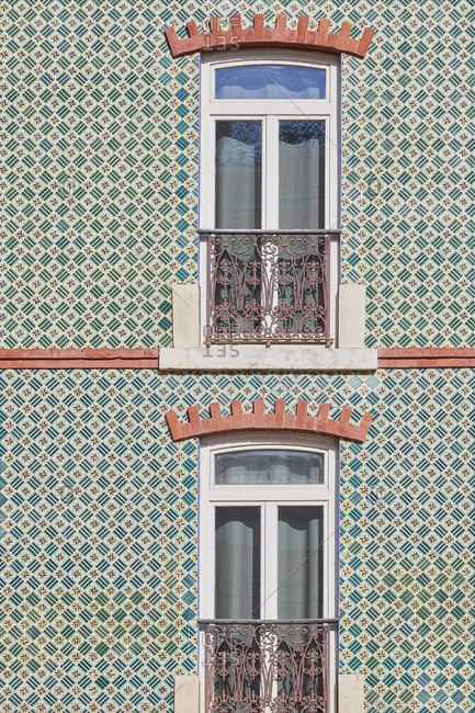 Window surrounded by decorative tile, Lisbon, Portugal