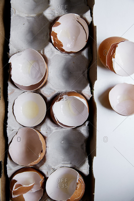 Empty egg shells in an egg box from above,