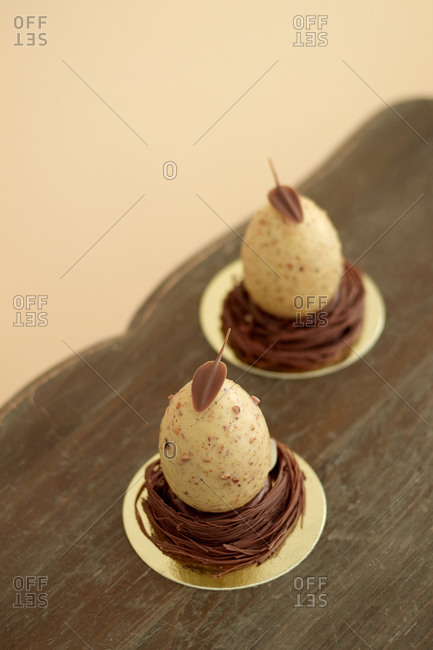 dessert Easter eggs made of chocolate with mousse nuts and decoration