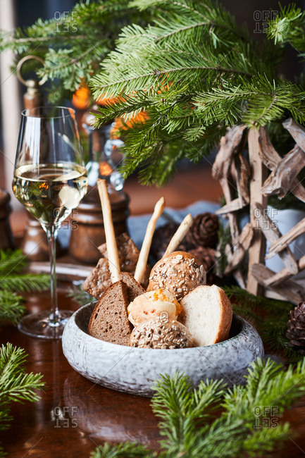 dinner white wine, bread basket with five types of bread, white, gray, black, with cereals, cheese