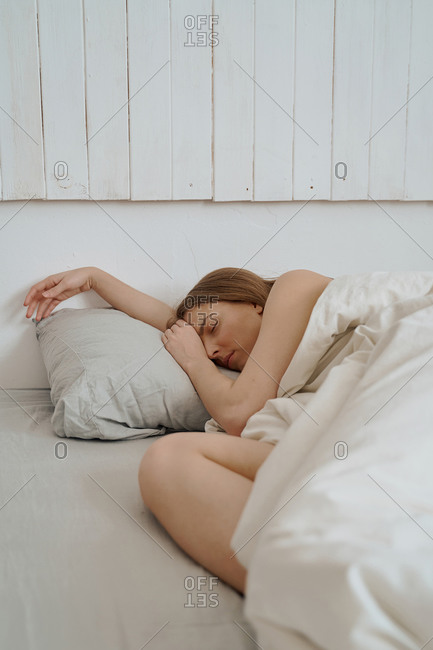 woman sleeps at home in bed during quarantine, morning Wake-up hours, laziness and relaxation, bedtime