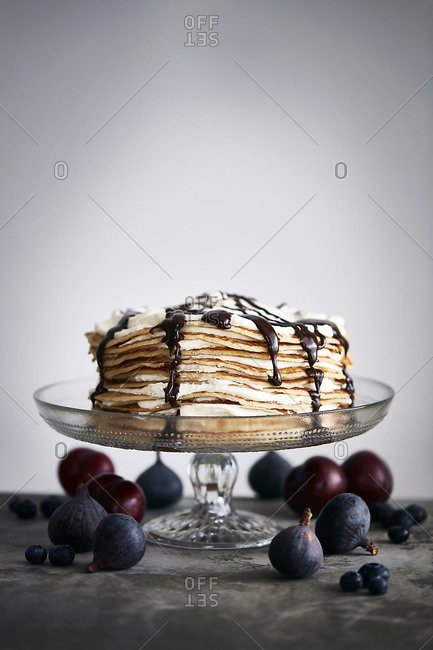 Pancake stack with chocolate sauce, whole figs