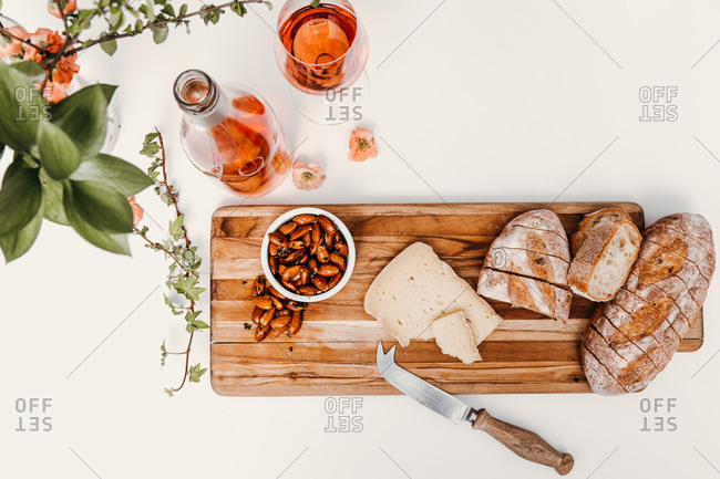 Snack board with wine styled on white