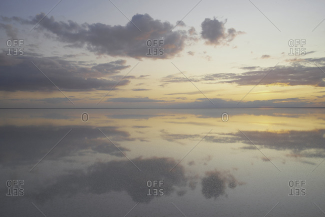Lake Elton, tranquility scene with mirrored warm tone cloudscape