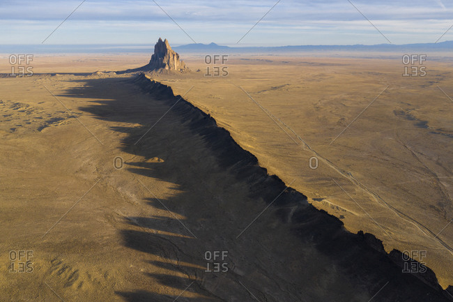 Aerial with leading line of lava towards Shiprock in New Mexico