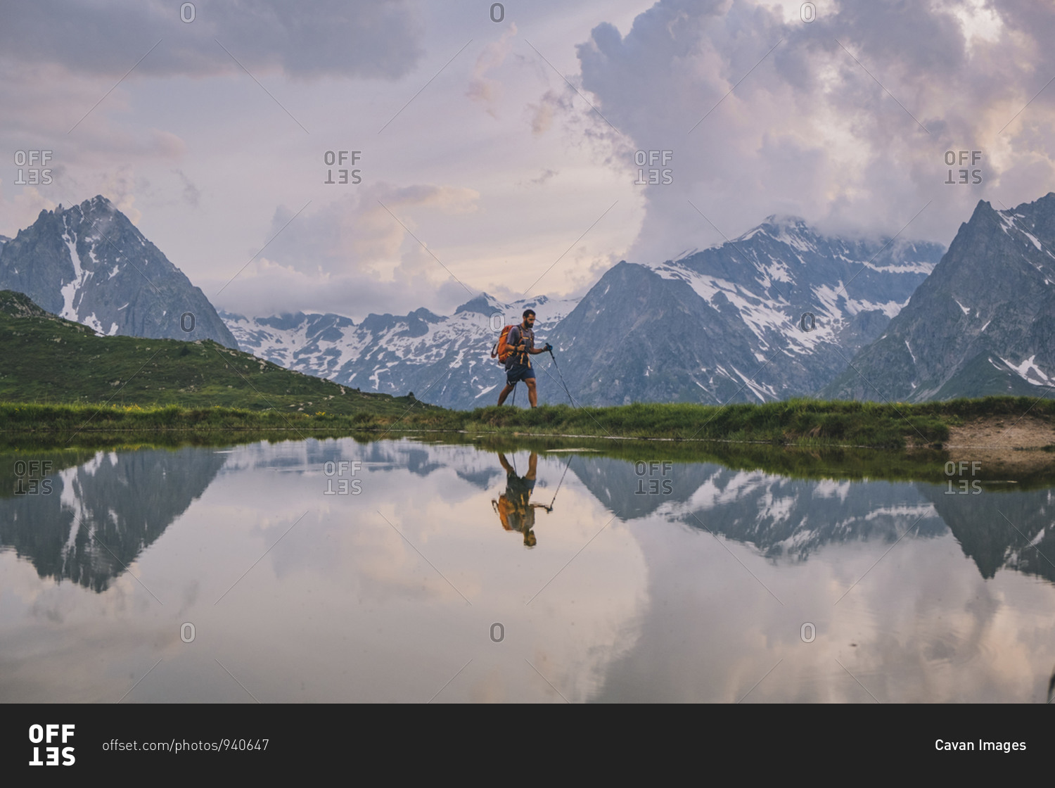 young-male-hiking-through-at-the-french-alps-chamonix-france-stock