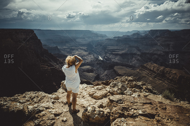 Woman photographing Grand Canyon environment at summer