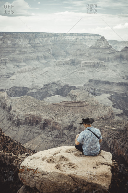Man Observe Colorado River from Grand Canyon point
