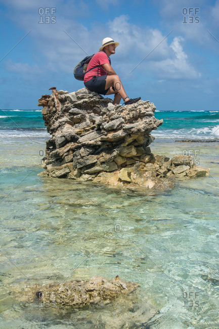 Man seated on a rock formation