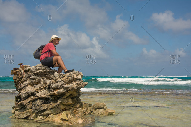 Man seated on a rock formation
