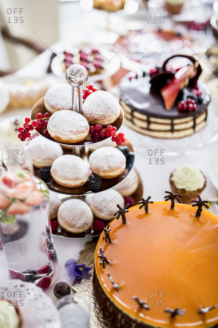 Dining table filled with all kinds of snacks and desserts