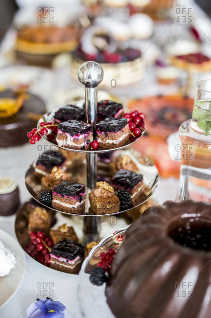 Dining table filled with all kinds of snacks and desserts