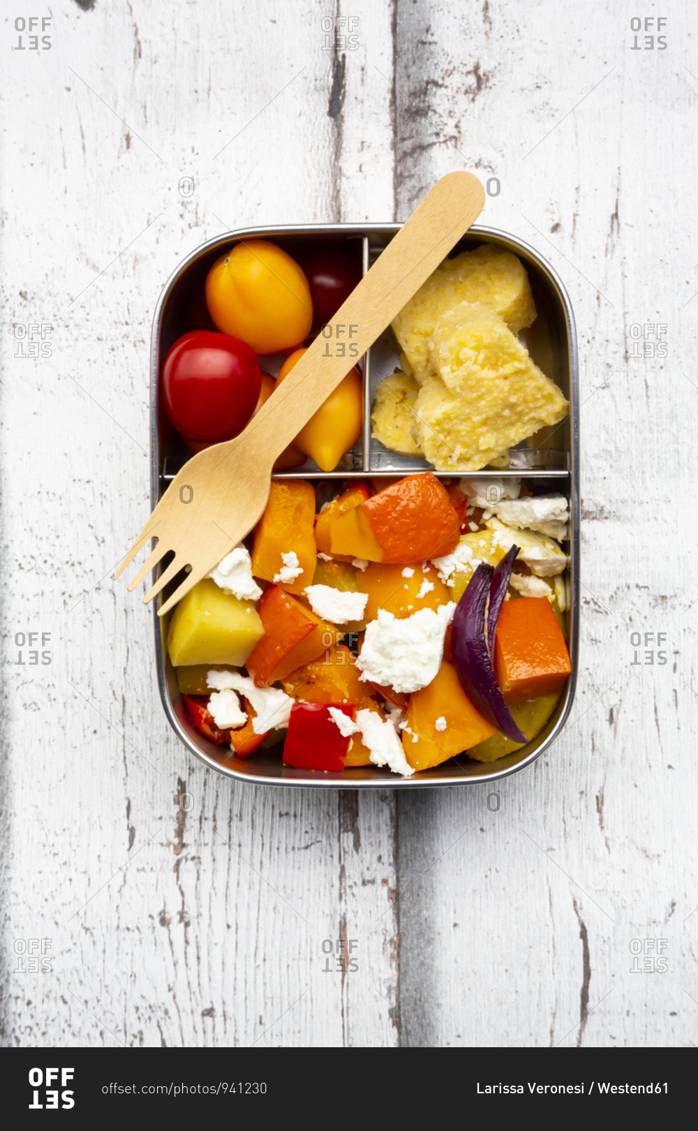 Lunch box with autumn oven baked vegetables feta cheese and heart