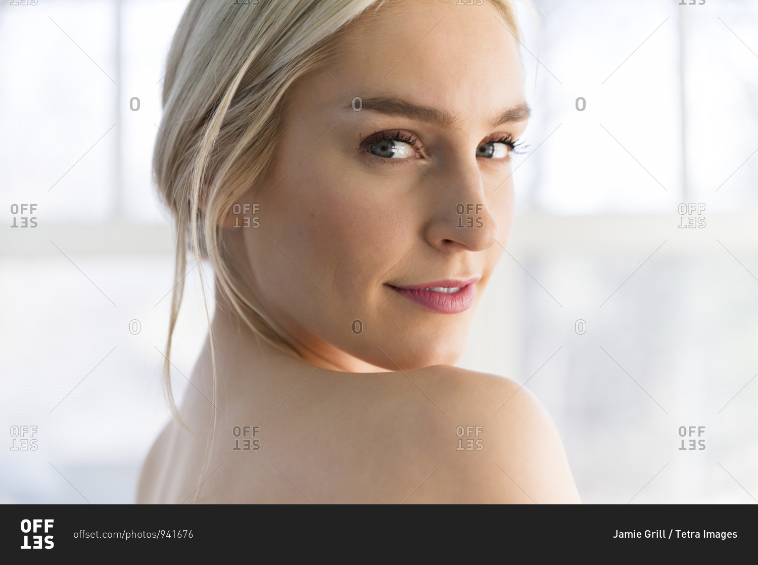 Portrait Of Woman Looking Over Her Bare Shoulder Stock Photo Offset