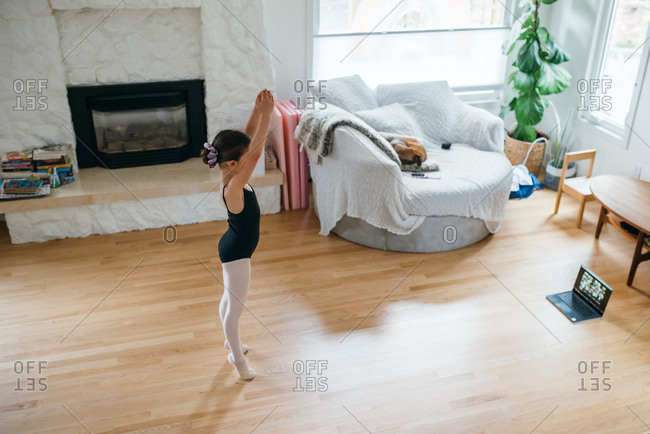 Girl practicing ballet at home
