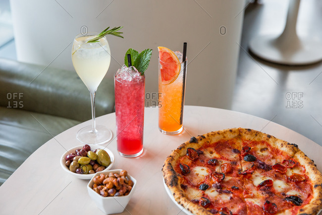 Variety of cocktails served with pizza