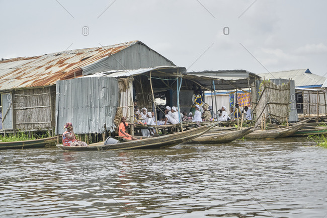Ganvie, Benin, Africa; November 10, 2019; Ganvie is a lake village in Benin, Africa, lying in Lake Nokou�, near Cotonou. It is probably the largest lake village in Africa. 
Stilt houses are raised on piles all over the lake. The village was created in the sixteenth or seventeenth centuries by the Tofinu people who took to the lake to avoid Fon warriors who were capturing slaves for sale to European traders. The village was added to the UNESCO World Heritage Tentative List on October 31, 1996 in the Cultural category.