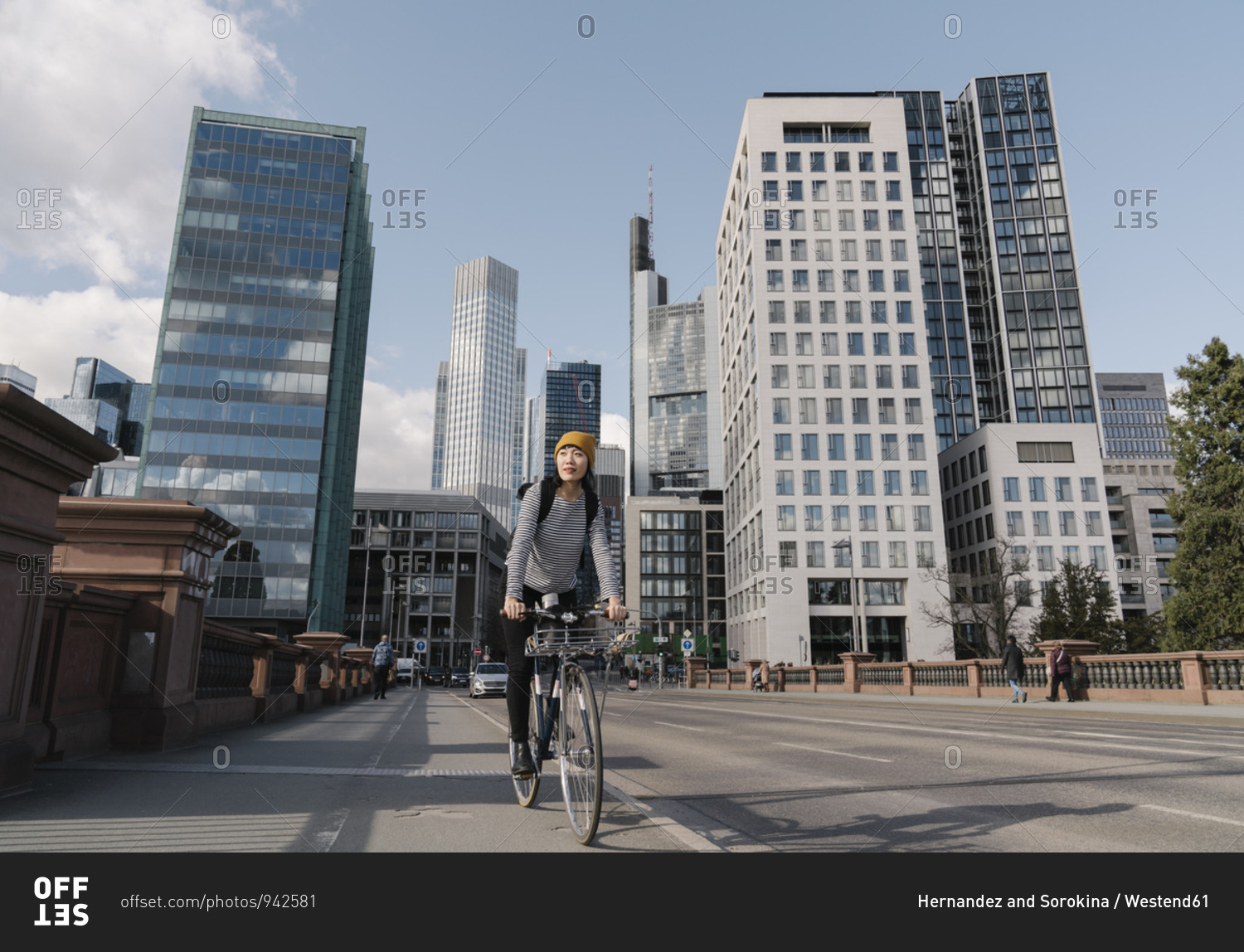 Woman riding bicycle in the city- Frankfurt- Germany
