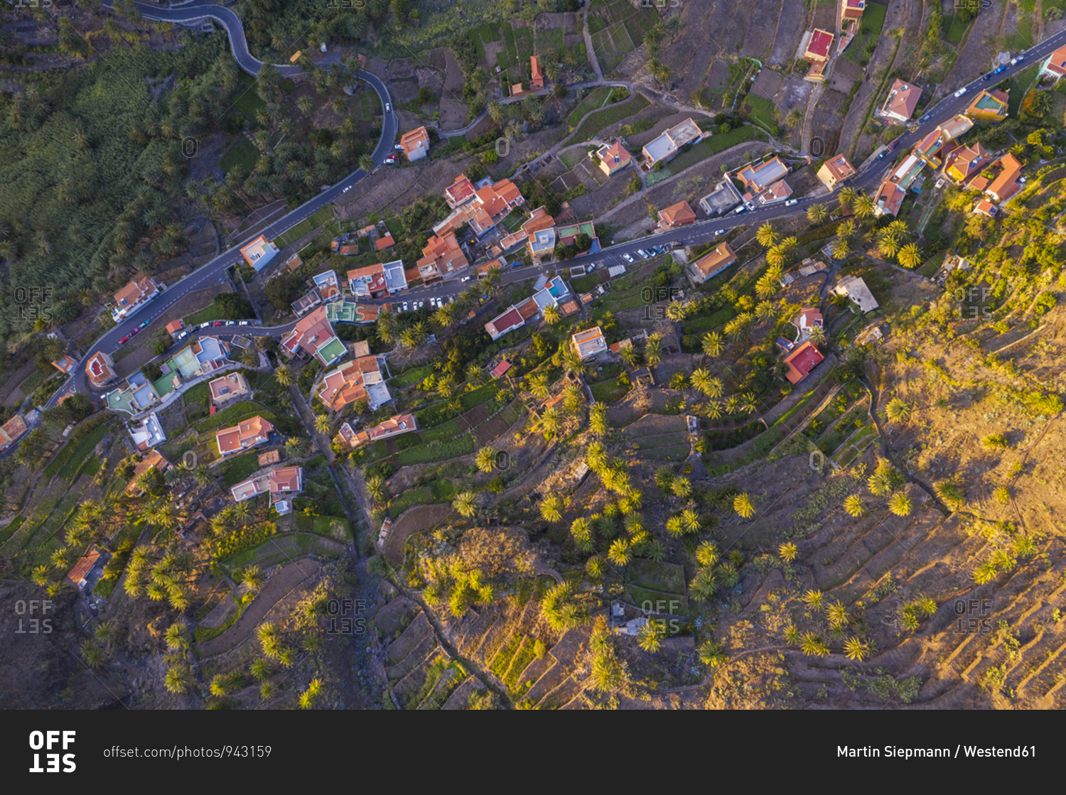 Spain- Santa Cruz de Tenerife- Valle Gran Rey- Aerial view of village houses on La Gomera at dusk