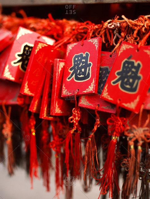 Taiyuan, Shanxi, China - July 13, 2011: Lucky pendants on red strings in Pingyao / China