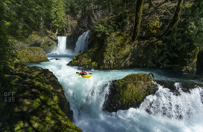 White Salmon, WA, United States - March 18, 2020: A kayaker descends the Little White Salmon River in WA.