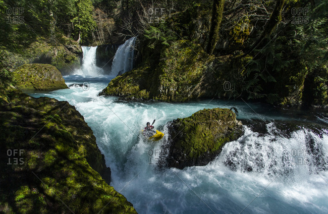 White Salmon, WA, United States - March 18, 2020: A kayaker descends the Little White Salmon River in the WA.