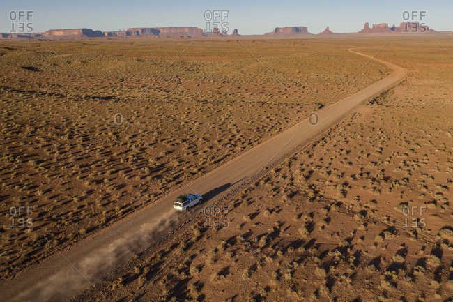 Tacoma Truck long desert road toward Iconic Monument Valley Arizona