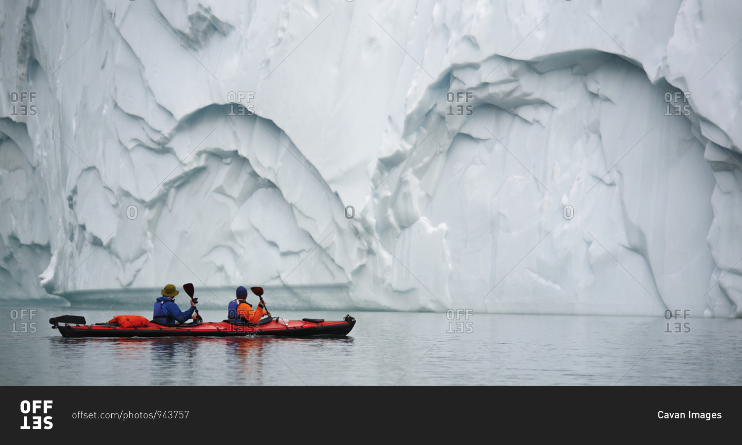 2 men traveling with a sea kayak in Eastern Greenland