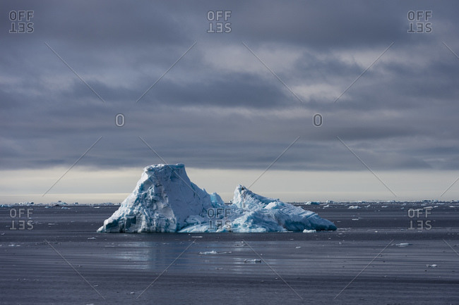 Arctic ocean ice floe and iceberg, Erik Eriksenstretet strait separating Kong Karls Land from Nordaustlandet, Svalbard, Norway