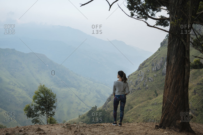 Woman enjoying view on hilltop, Ella, Uva, Sri Lanka
