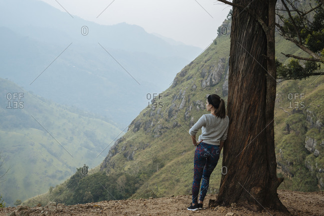 Woman enjoying view on hilltop, Ella, Uva, Sri Lanka