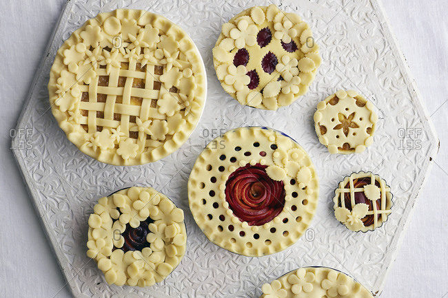Overhead view of uncooked tarts ready for baking