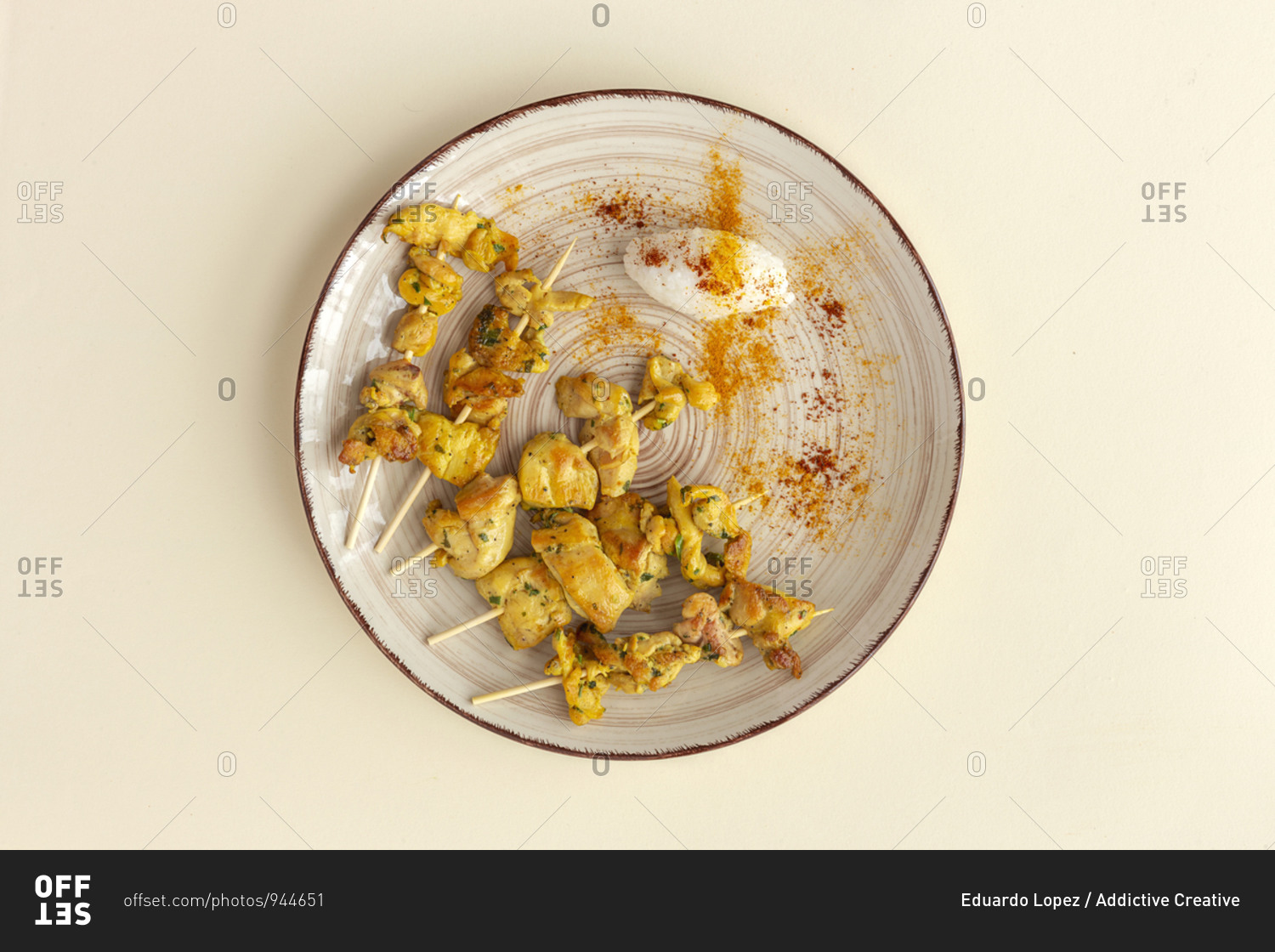 Homemade Moorish skewers with rice of meat with spices. Typical oriental food from above on beige background. Flat lay. Top view