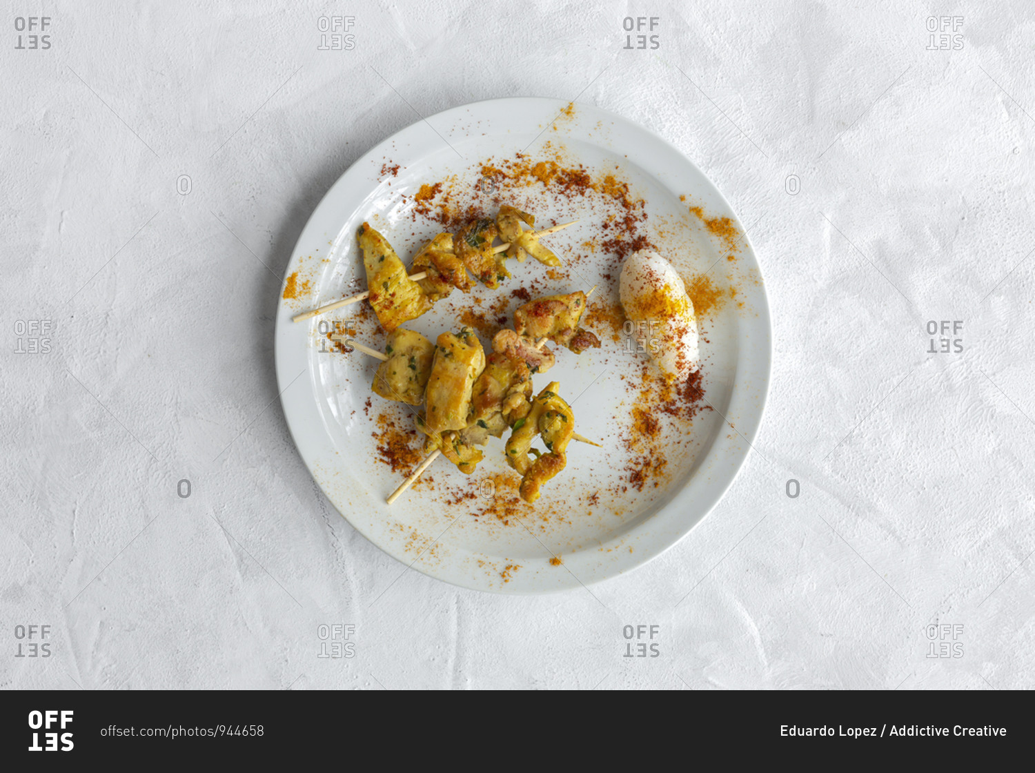 Homemade Moorish skewers with rice of meat with spices. Typical oriental food from above on white background. Flat lay. Top view