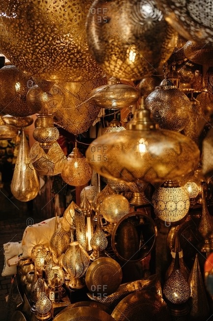 Closeup of various Moroccan traditional antique lanterns and lamps hanging on local market in Marrakesh city