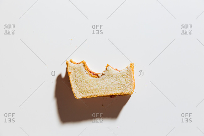 Peanut and butter jelly sandwich with bites taken out