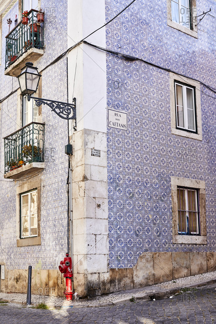Lisbon, Portugal - July 21, 2019: Corner building with blue decorative tile